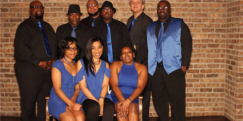 Photo shows members of the Breeze Band, including Maurice Troop, assistant principal at Erie High School.
